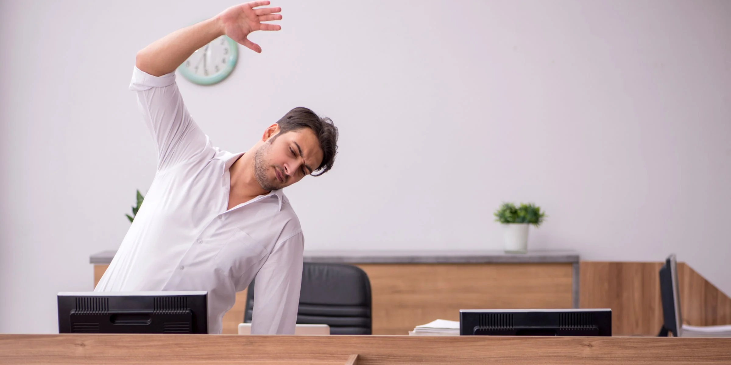 Corporate team collaborating in a bright open office